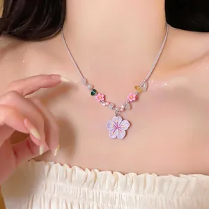 Handmade resin flower and stone beaded necklace featuring vibrant summer vacation vibes.
