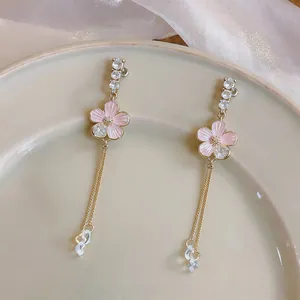 Elegant pink enamel flower long tassel earrings with sparkling clear stone accents