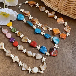 Close-up detail of vibrant shell and starfish beaded necklaces for beach vacation style