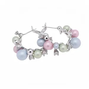 Elegant silver hoop earrings with pastel pearls and sparkling cubic zirconia stones.
