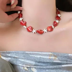 Red shell beads and white starfish necklace charm for beach vacation style jewelry