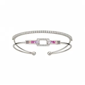 Double-layer rectangular 18k gold plated bangle with sparkling zircons and pink stones.