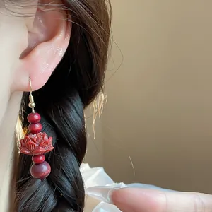 Vintage Chinese style earrings with carved red wood lotus and beads on gold hooks