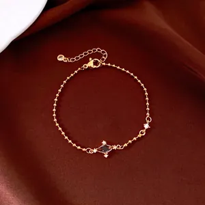 Elegant vintage gold beaded bracelet featuring a sparkling star-shaped zircon centerpiece.