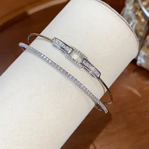 Close-up of elegant double-layer 18k gold plated bangle with sparkling cubic zirconia