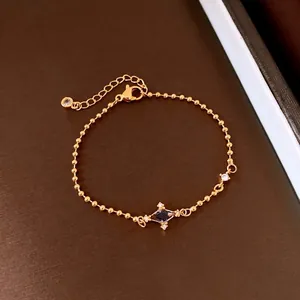 Vintage minimalist gold ball chain bracelet featuring a central zircon star pendant