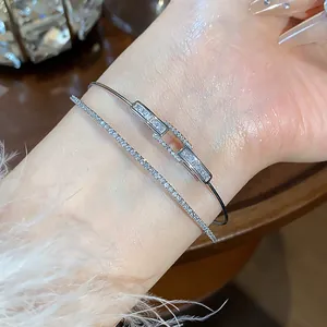 Close-up of luxury 18k gold plated double layer bangle featuring sparkling zircon stones
