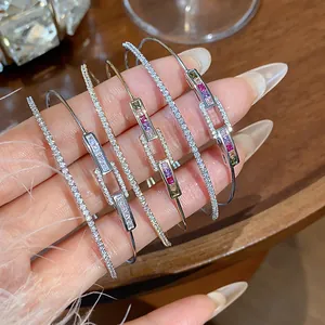 Close-up of 18k gold plated double-layer bangles with colorful CZ rectangular links