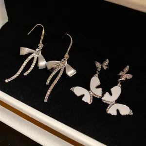 Elegant French style zircon butterfly and bow drop earrings in a black jewelry box
