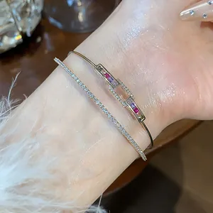 Macro view of 18k gold-plated double-layer bracelet with colorful zirconia stones