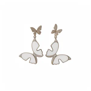 Elegant French style white enamel butterfly drop earrings with sparkling zircon accents.