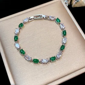 Elegant silver bracelet with sparkling green and clear zircon stones in a gift box