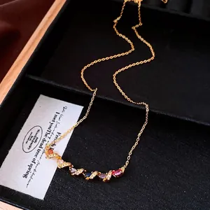 Elegant summer dopamine necklace featuring colorful oval gemstones and gold twist design