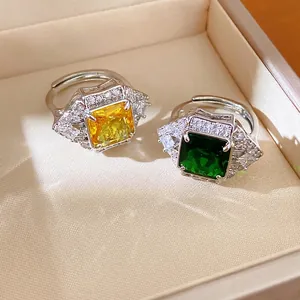 Vintage style square yellow and green zircon open rings presented in a luxury jewelry box