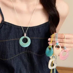 Colorful marbled resin pendant long necklace with vibrant dopamine style for women fashion