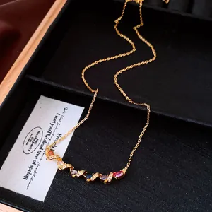 Detailed macro view of the dopamine style twisted gold necklace with colorful oval stones