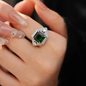 Detailed macro view of a vintage palace style ring featuring a square emerald green zircon