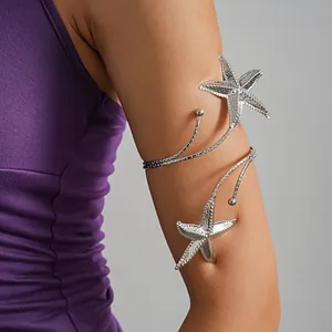 Detailed view of a stylish silver starfish open arm cuff bracelet for beach vacation
