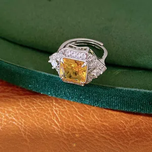 Detailed view of a vintage square yellow zircon open ring with sparkling accents