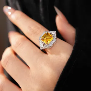 Exquisite detail of a palace-style ring featuring a large square yellow zircon center stone