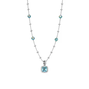 Elegant silver chain necklace featuring a blue square stone pendant with halo crystals.