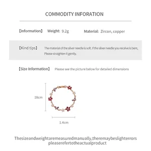 Detailed product info for gold-plated flower and cross bracelet with dimensions.