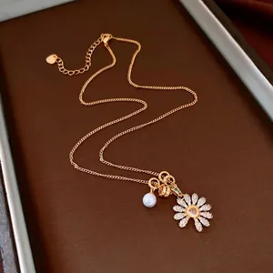 Collier vintage doré avec marguerite en zircon étincelant et perle élégante pour femme