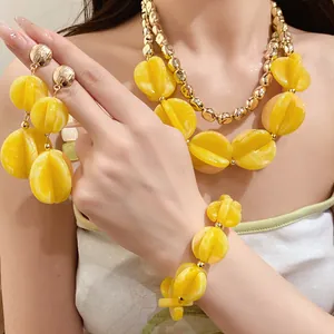 Luxury yellow acrylic bead jewelry set including layered necklace bracelet and earrings