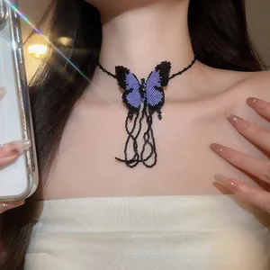 Handmade purple and black beaded butterfly choker necklace detail on female model neck