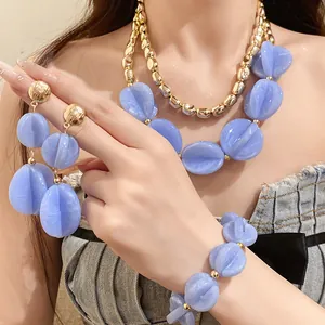 Detailed view of lavender acrylic double-layer jewelry set with necklace, earrings, and bracelet