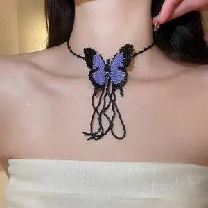 Detailed view of a purple and black beaded butterfly choker necklace worn by a model