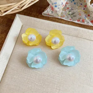 Elegant Korean style flower stud earrings with pearls in vibrant yellow and mint blue