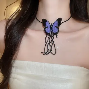 Detailed view of a purple and black beaded butterfly choker with delicate hanging strands