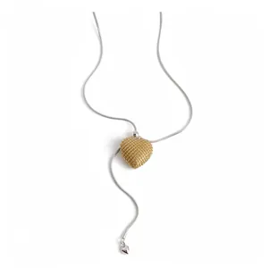 Elegant silver lariat necklace featuring a textured gold mesh heart pendant for women