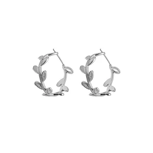 Elegant minimalist silver leaf branch hoop earrings with a sparkling textured finish for women
