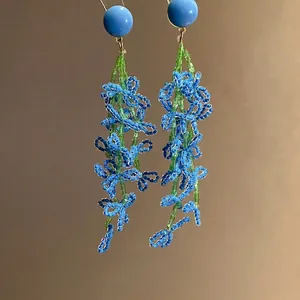 Elegant blue and green beaded flower tassel drop earrings with silver needle posts