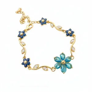 Bracelet vintage élégant plaqué or 18 carats avec des fleurs en zircon bleu brillant