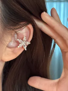 Close-up of a sparkling cubic zirconia star ear cuff for no-piercing wear.