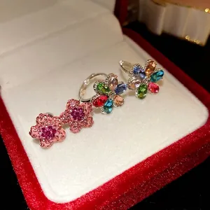 Exquisite floral earrings with colorful sparkling crystals in a red jewelry box