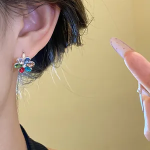 Colorful flower-shaped stud earring featuring multi-color sparkling cubic zirconia.