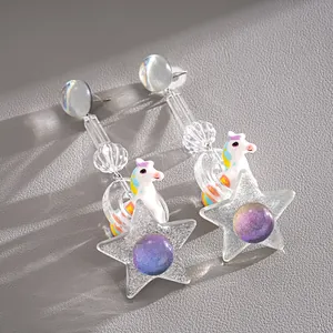 Dreamy unicorn and glitter star resin drop earrings with vibrant purple orb detail