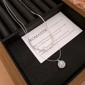 Elegant French style double-layered necklace with zircon star pendant and delicate pearls