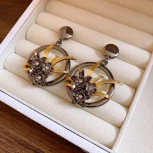 Vintage hollow flower dangle earrings with rhinestones in gunmetal and gold finish