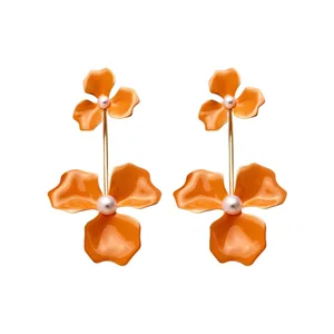 Vibrant orange enamel flower drop earrings with elegant pearl centers for a stylish look