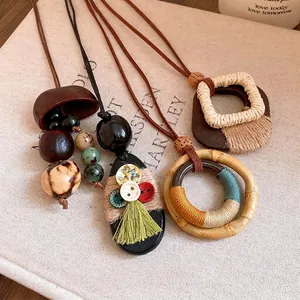 Bohemian Maillard style necklace with wood pendants and hemp rope details