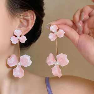 Fashionable oversized pink flower drop earrings with elegant pearl details for women