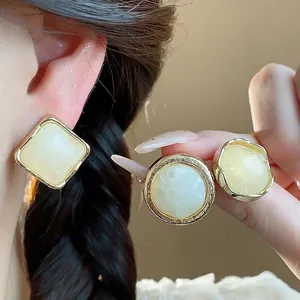 Elegant retro resin geometric stud earrings with gold-tone borders for a minimalist look