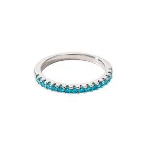 Minimalist silver eternity ring featuring a row of sparkling blue cubic zirconia stones