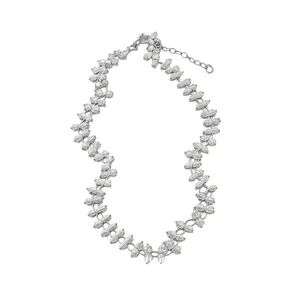 Elegant silver crystal flower necklace with marquise-cut stones on white background.