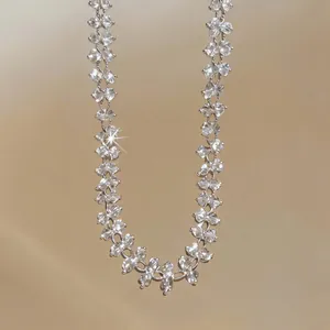 Detail view of an elegant crystal flower necklace with a shimmering starburst effect